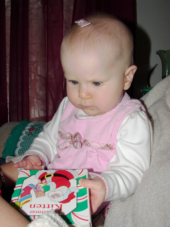 Katelyn examining a gift (179.84 KB)
