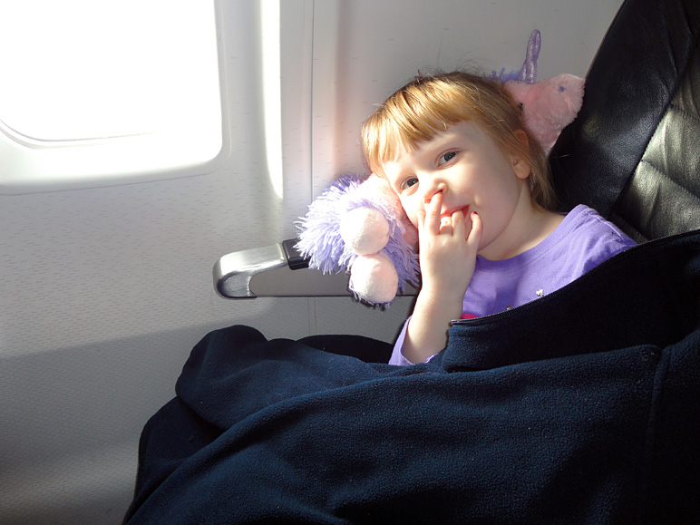 Kate, looking pretty comfy on the plane (153.77 KB)