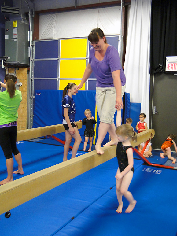 They got Anna up on the balance beam; Kate helped.  :-) (195.44 KB)
