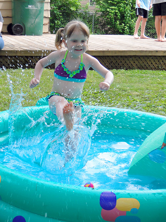 Kate kicking some water in her pool at her birthday party (313.94 KB)