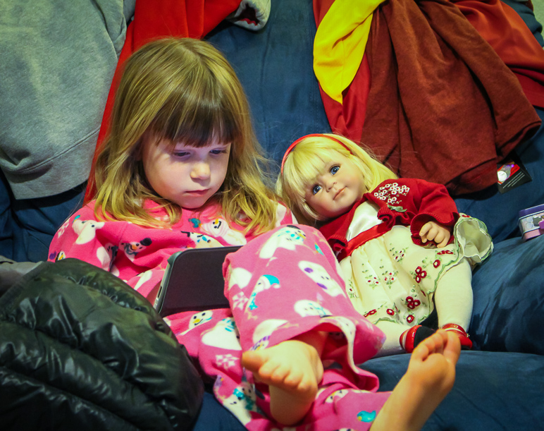 Katelyn, messing with her Nook next to her new American Girl doll. (301.28 KB)