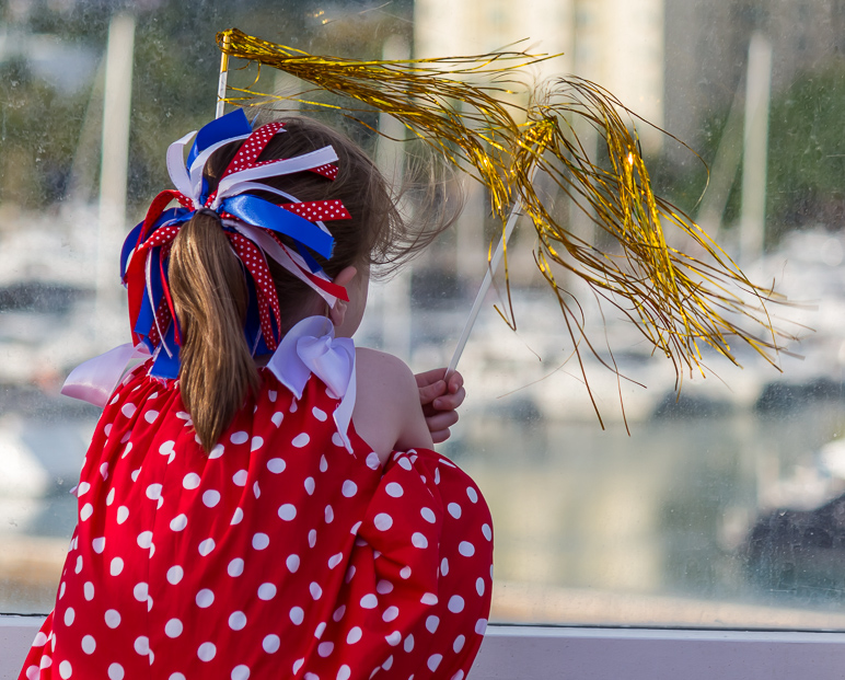 Katelyn, watching Miami go by, still clutching those streamers. (313.57 KB)