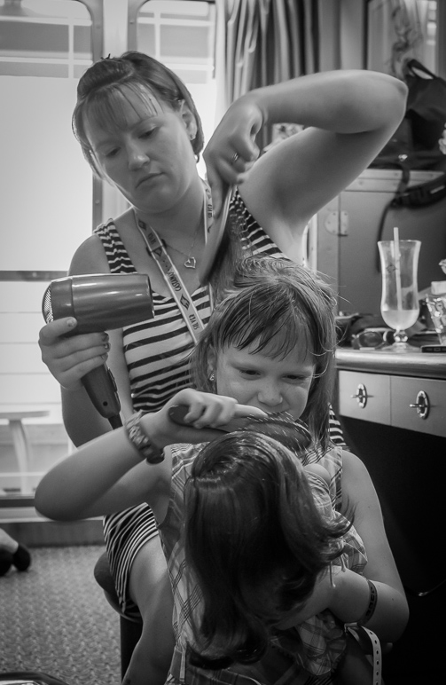 Anna doing Kate's hair while she does the hair of her American Girl doll, Emily. (144.96 KB)