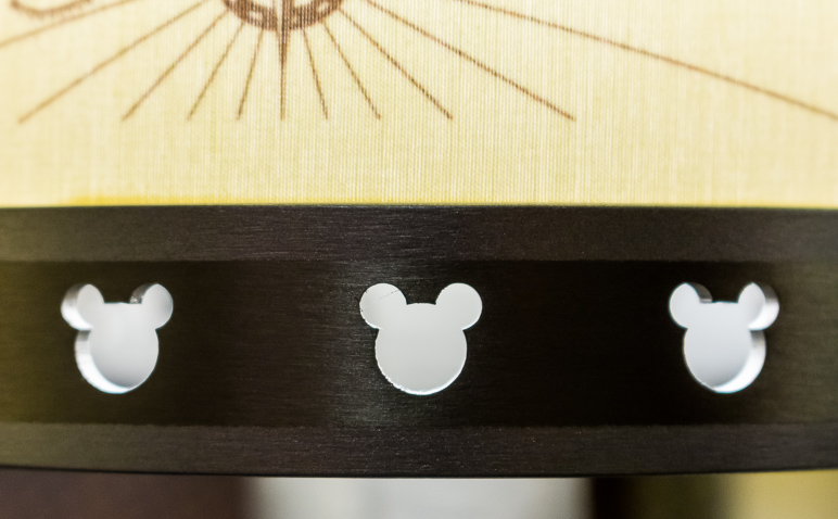 These little Mickey heads are in the metal around the bottom of the lamps in the room. (143.37 KB)
