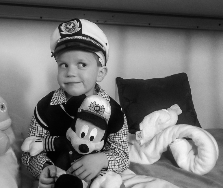 Luke with his captain's hat and a Mickey Mouse with a matching hat. (181.91 KB)