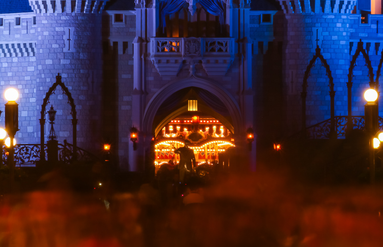 Looking down Main Street, that's the Walt Disney statue framed in front of the tunnel thru Cinderella Castle, backlit by the merry-go-round. (190.97 KB)