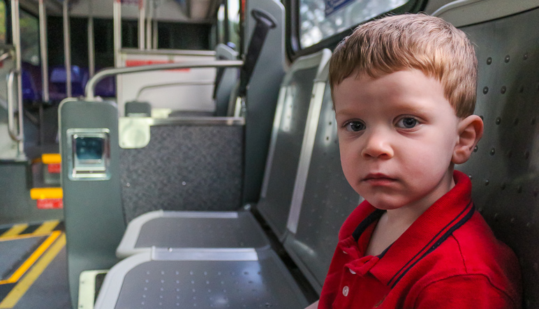 Lucas certainly looks thrilled about being on the bus so early in the morning. (174.39 KB)