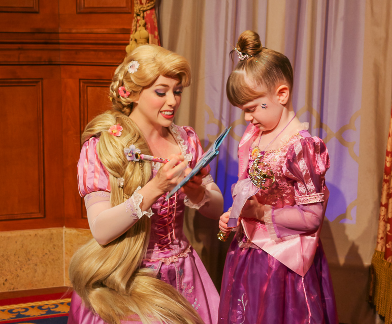 Rapunzel telling Kate stories while signing her book. (275.18 KB)