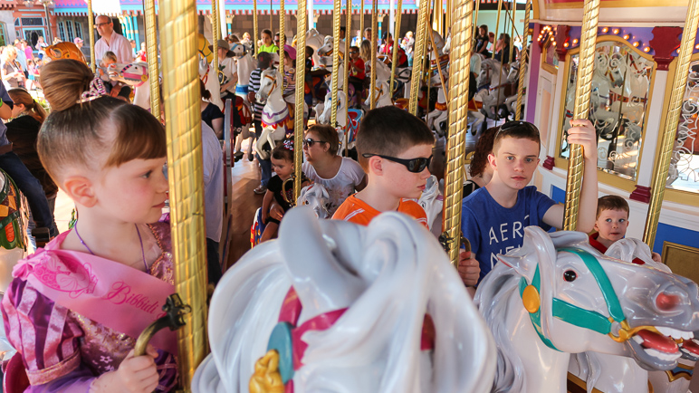 All four kids on the Magic Kingdom carousel. (281.74 KB)