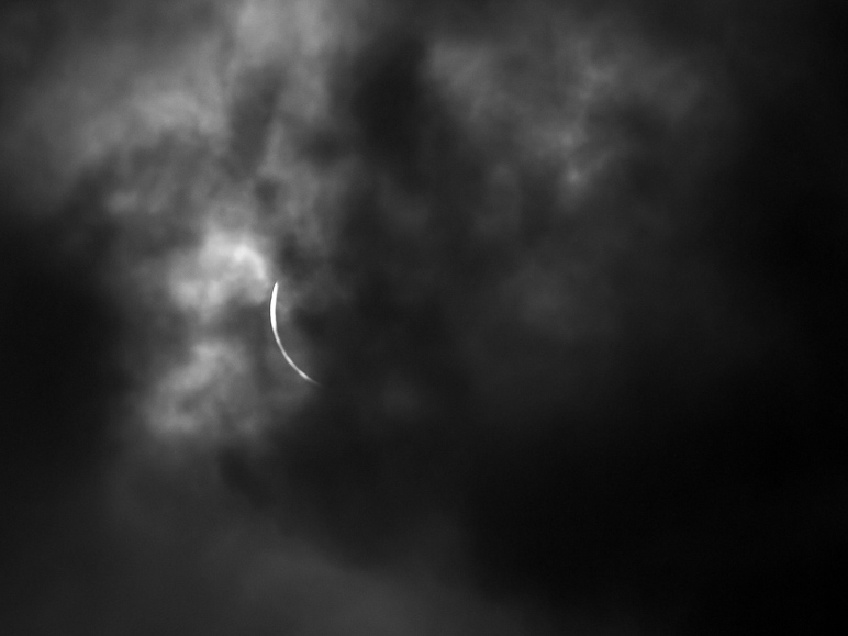 A photo of the eclipse, 8 seconds before totality began (C2). The clouds were too thick to see anything immediately after this. (88.09 KB)