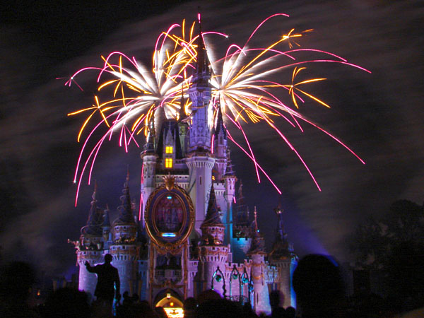 White, orange, and purple fireworks behind Cinderella's Castle (98.62 KB)
