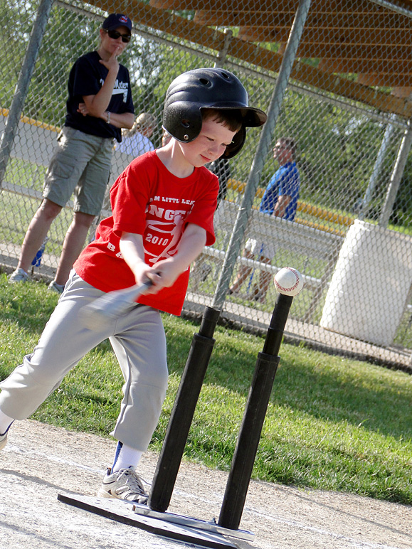Is Andrew smirking as he swings? (318.71 KB)