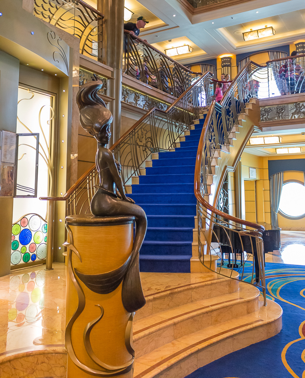 She sits centered on the main staircase. (379.41 KB)