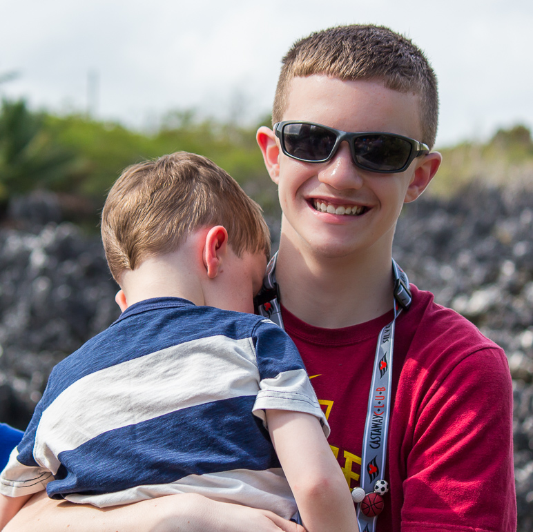 A smiling Jake holding a cuddling Lucas (319.51 KB)