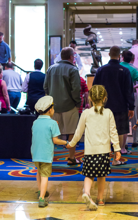 Kate and Luke holding hands as they go into the main lobby. (237.57 KB)