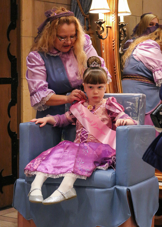 She's being adorned with a Bibbidi Bobbidi Boutique sash (284.76 KB)