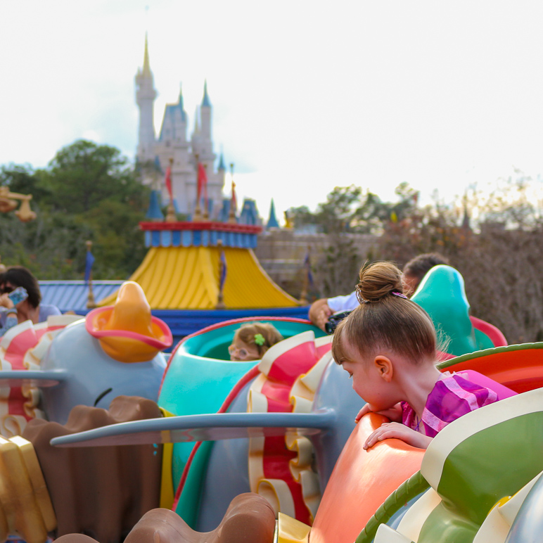 Katelyn looking over the edge with Cinderella's Castle in the background (246.65 KB)